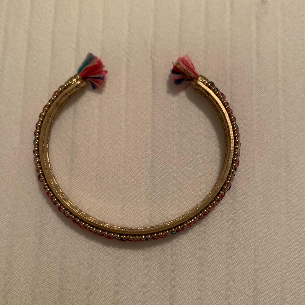 Stella and Dot gold tasseled cuffed bracelet
